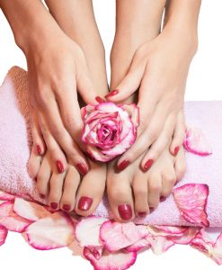 beautiful legs, hands, flowers and petals on towel