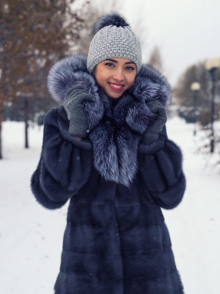 Beautiful Russian girl in a chic winter coat